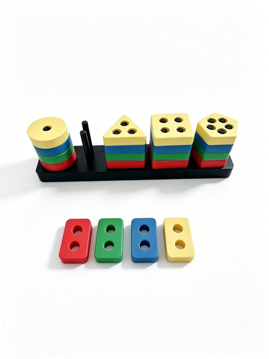 3D-printed sorting base with one peg empty and four rectangle pieces in red, green, blue and yellow